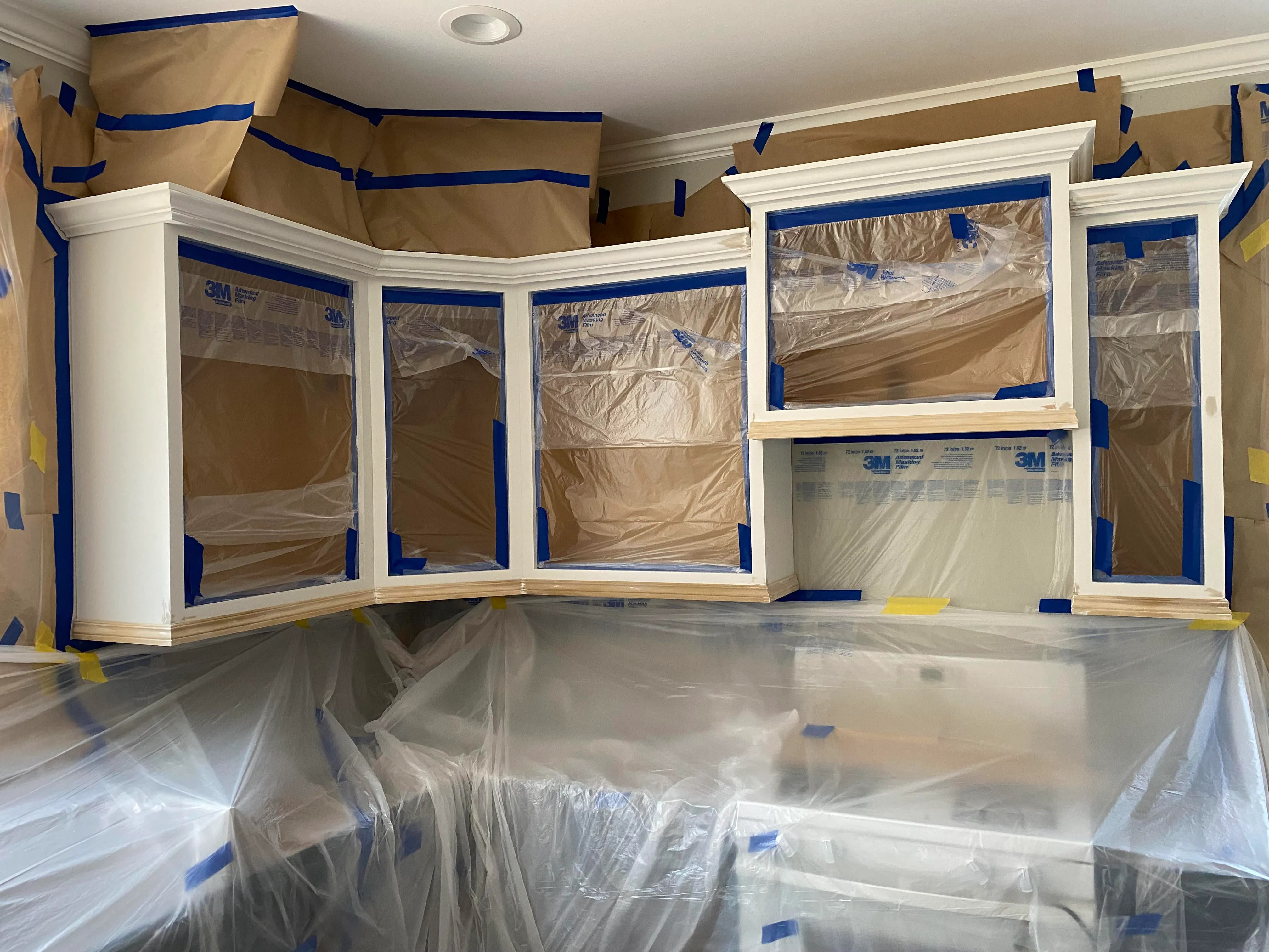 Luxury kitchen painting project Ottawa - dark gray cabinets, marble countertop, geometric backsplash design