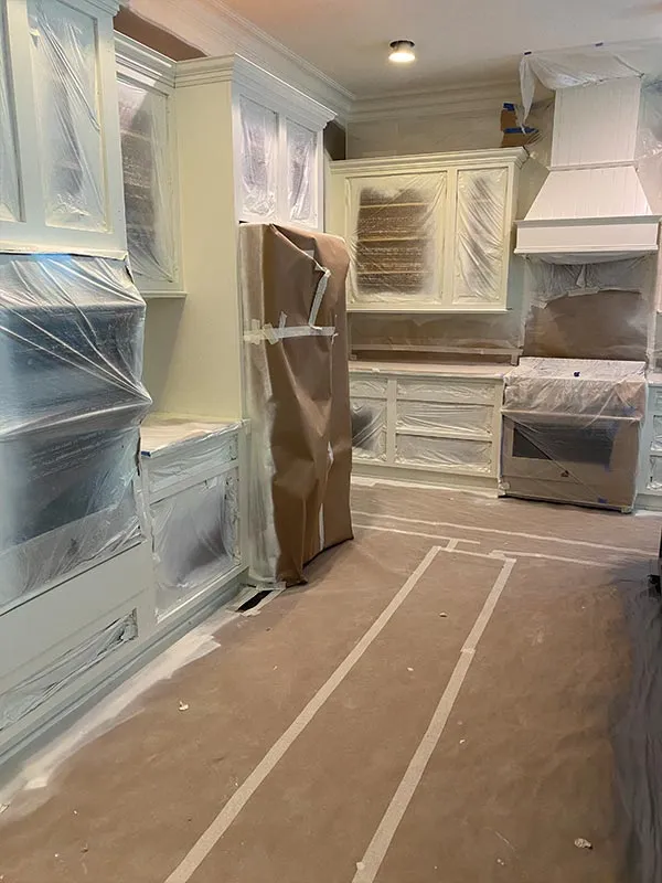 Cozy kitchen painting in Ottawa - light gray cabinets, wooden countertop, farmhouse style renovation