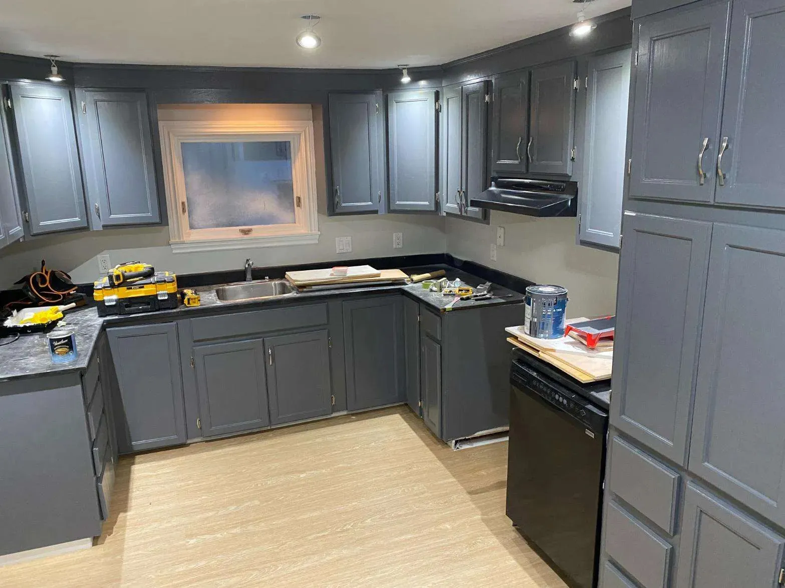 Modern kitchen painting project Ottawa - black cabinets, quartz countertop, subway tile backsplash