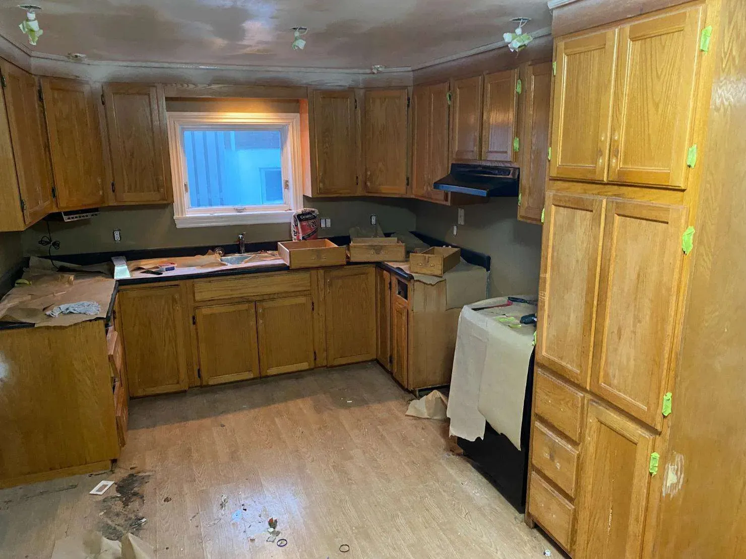 Spacious kitchen renovation Ottawa - beige cabinets, wooden island, professional painting services